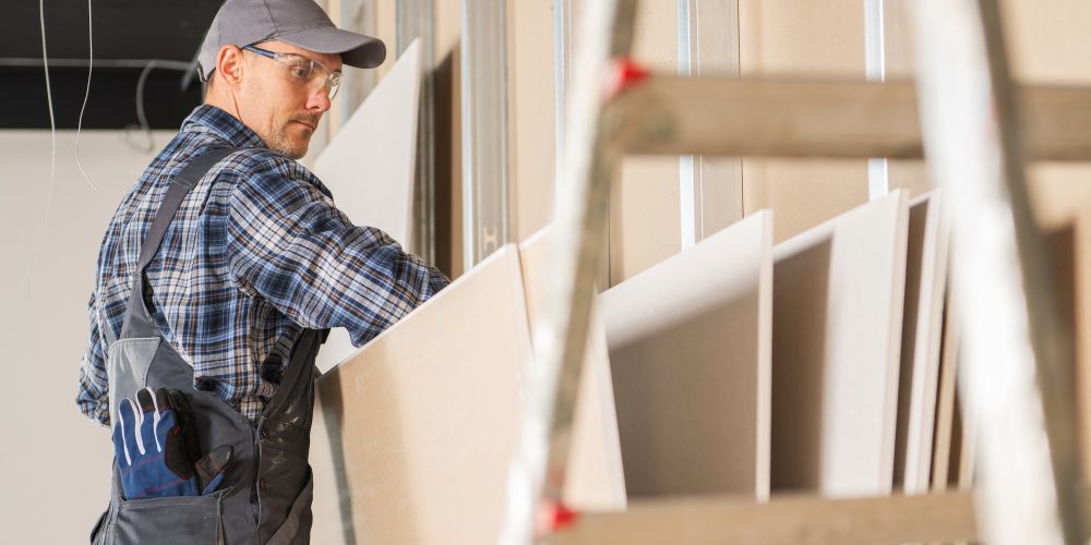 construction-site-worker-selecting-right-drywall-p-CPR27TL